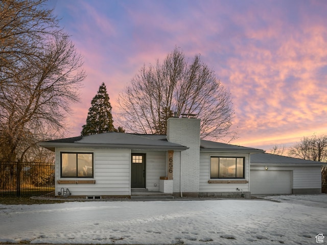 view of front of property featuring a garage