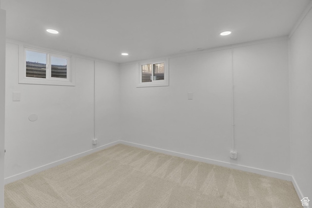 unfurnished room with light carpet
