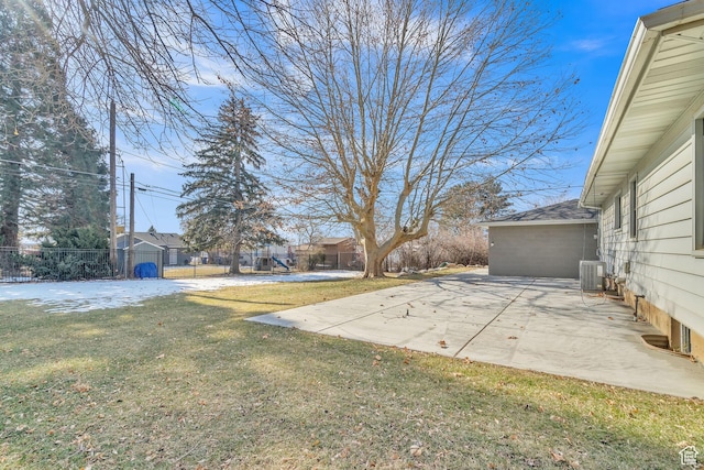 view of yard with central AC and a patio area