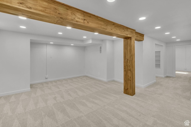 basement with light colored carpet