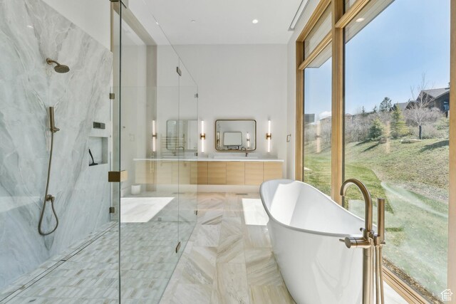 8195 N Ranch Garden Rd, Park City, UT 84098 - full bath featuring a marble finish shower, a freestanding bath, vanity, and recessed lighting