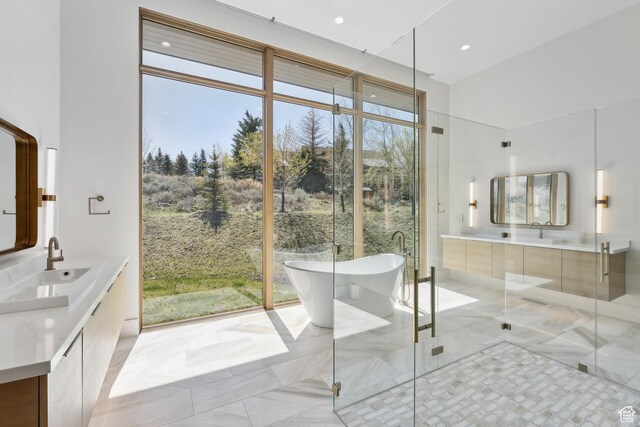 8195 N Ranch Garden Rd, Park City, UT 84098 - bathroom with vanity, a freestanding bath, a shower stall, tile patterned flooring, and recessed lighting