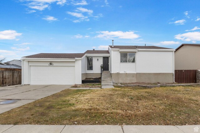 6374 W 3100 S, West Valley City, UT 84128 - ranch-style house featuring a garage and a front yard