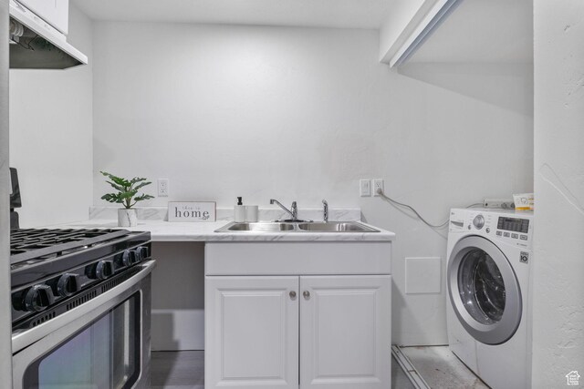 6374 W 3100 S, West Valley City, UT 84128 - laundry area with washer / clothes dryer and sink