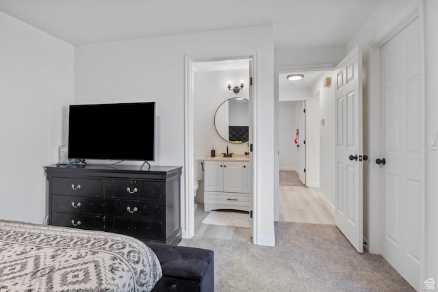 6374 W 3100 S, West Valley City, UT 84128 - bedroom featuring connected bathroom, sink, and light colored carpet