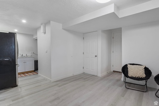 6374 W 3100 S, West Valley City, UT 84128 - living area featuring a textured ceiling and light wood-type flooring