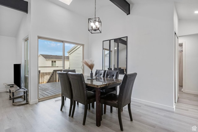 6374 W 3100 S, West Valley City, UT 84128 - dining room featuring beam ceiling, high vaulted ceiling, light hardwood / wood-style flooring, and a notable chandelier