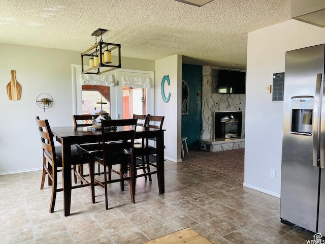 500 W 200 N, Paris, ID 83261 - dining space with a stone fireplace and a textured ceiling