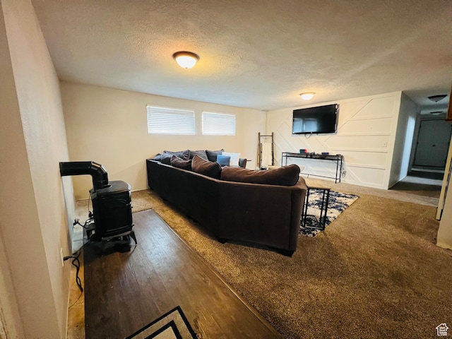 500 W 200 N, Paris, ID 83261 - living room with hardwood / wood-style flooring, a textured ceiling, and a wood stove