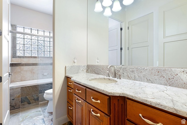 2085 N Tuweap Unit 52, St George, UT 84770 - bathroom featuring vanity, tiled bath, and toilet