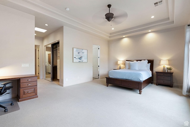2085 N Tuweap Unit 52, St George, UT 84770 - bedroom with a raised ceiling, light carpet, and ceiling fan