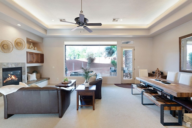 2085 N Tuweap Unit 52, St George, UT 84770 - living room with a raised ceiling, a premium fireplace, light colored carpet, and ceiling fan