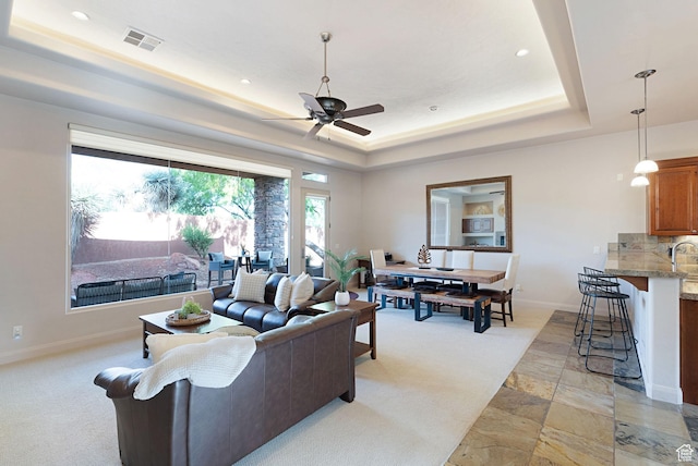 2085 N Tuweap Unit 52, St George, UT 84770 - living room with ceiling fan and a raised ceiling