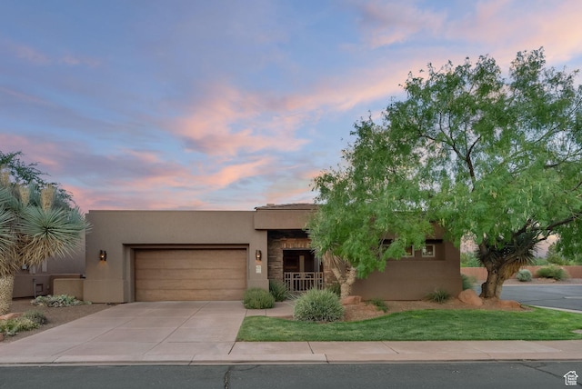 2085 N Tuweap Unit 52, St George, UT 84770 - pueblo-style home featuring a garage