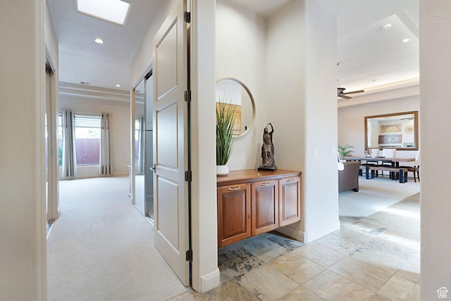 2085 N Tuweap Unit 52, St George, UT 84770 - corridor featuring a barn door and light colored carpet