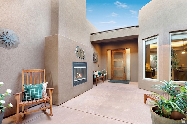 2085 N Tuweap Unit 52, St George, UT 84770 - view of patio / terrace with a tile fireplace