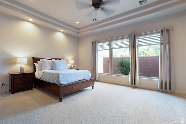 2085 N Tuweap Unit 52, St George, UT 84770 - bedroom featuring light carpet, a tray ceiling, and ceiling fan