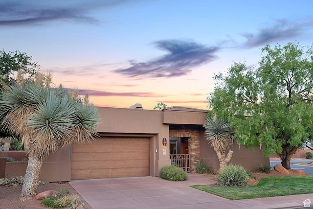2085 N Tuweap Unit 52, St George, UT 84770 - pueblo-style house featuring a garage