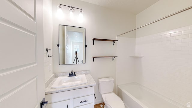 full bathroom featuring shower / tub combination, vanity, and toilet