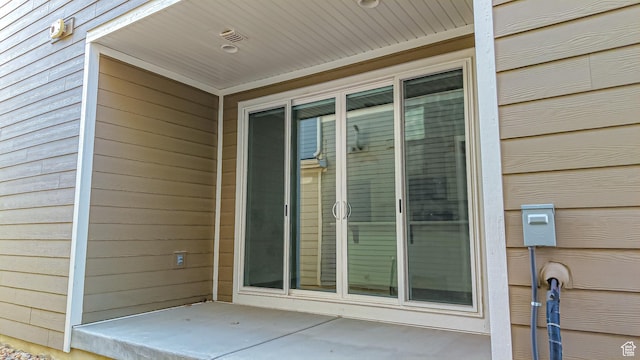 doorway to property with a patio