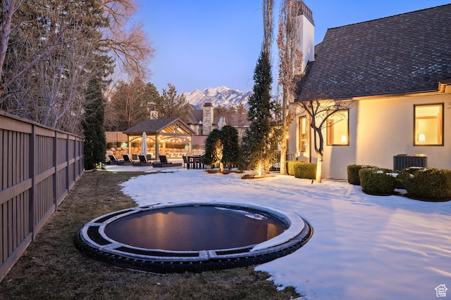 6121 Verness Cv S, Holladay, UT 84121 - exterior space featuring a trampoline, central air condition unit, a gazebo, a mountain view, and a patio area