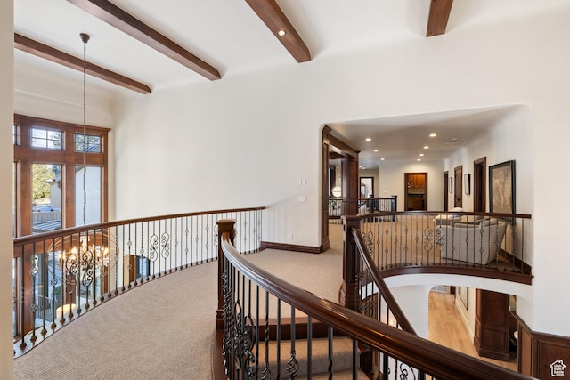 6121 Verness Cv S, Holladay, UT 84121 - corridor featuring beamed ceiling, carpet flooring, and a notable chandelier