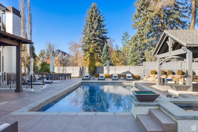 6121 Verness Cv S, Holladay, UT 84121 - view of swimming pool featuring a hot tub, a gazebo, and a patio