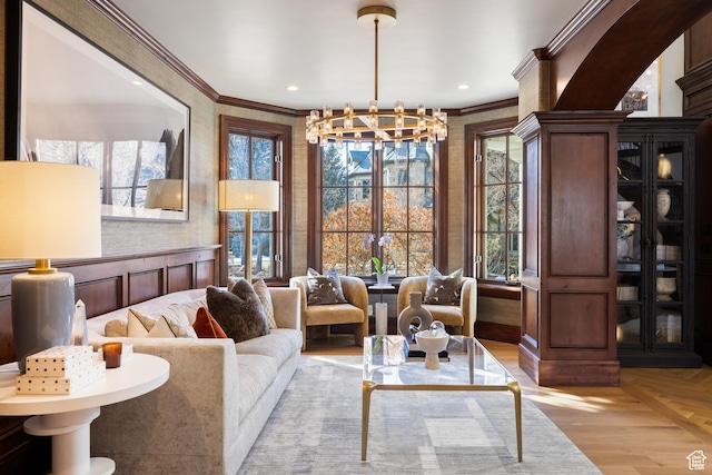 6121 Verness Cv S, Holladay, UT 84121 - living area with an inviting chandelier, ornamental molding, and light wood-type flooring