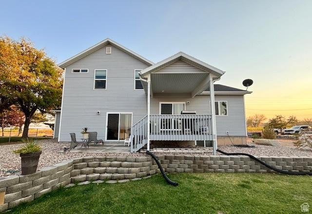 4093 E 4000 S, Vernal, UT 84078 - back house at dusk featuring a yard and a patio area