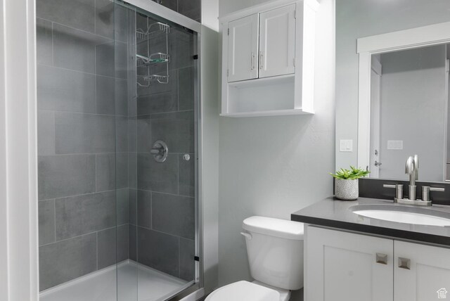 4093 E 4000 S, Vernal, UT 84078 - bathroom featuring vanity, a shower with shower door, and toilet