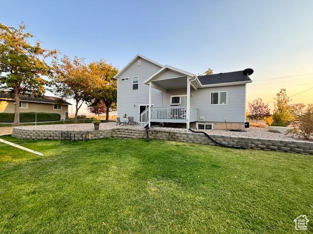 4093 E 4000 S, Vernal, UT 84078 - back house at dusk with a wooden deck and a yard