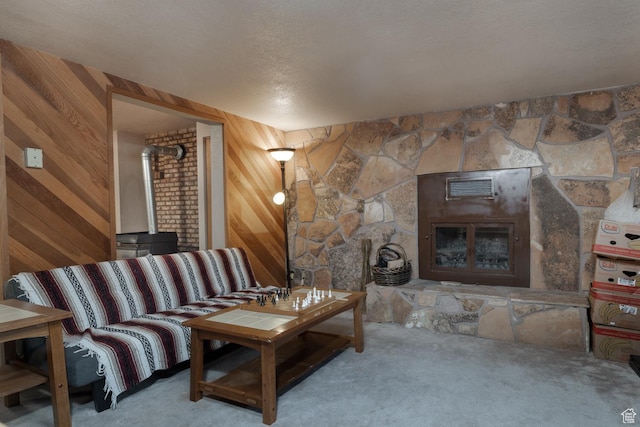 4111 E 4000 S, Vernal, UT 84078 - living room with carpet flooring, wooden walls, a textured ceiling, and a wood stove