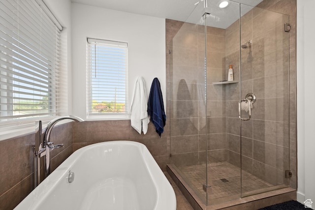 4513 S Bleecker Pl E, Millcreek, UT 84117 - bathroom featuring shower with separate bathtub