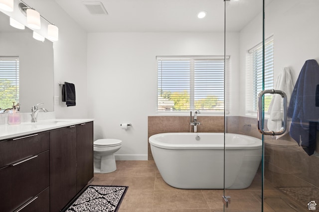4513 S Bleecker Pl E, Millcreek, UT 84117 - bathroom featuring vanity, a tub to relax in, tile patterned floors, and toilet