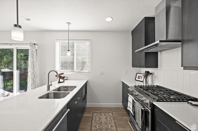 4513 S Bleecker Pl E, Millcreek, UT 84117 - kitchen with sink, hanging light fixtures, stainless steel appliances, dark wood-type flooring, and wall chimney exhaust hood