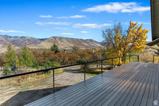 wooden deck featuring a mountain view