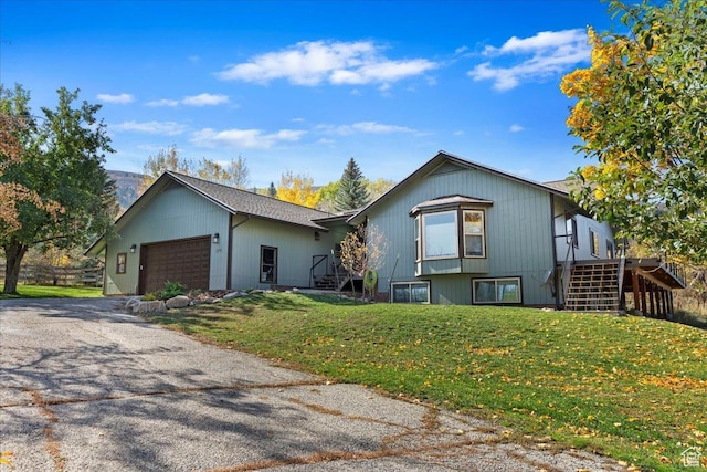 view of front facade featuring a garage and a front lawn