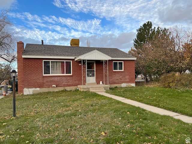 view of front of home with a front yard