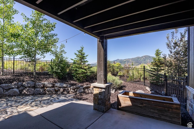10725 N Hideout Trl, Hideout, UT 84036 - fenced backyard featuring a patio area and a mountain view