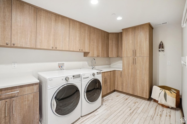 10725 N Hideout Trl, Hideout, UT 84036 - washroom featuring independent washer and dryer, cabinet space, light wood-type flooring, and recessed lighting