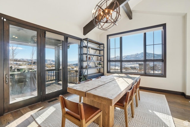 10725 N Hideout Trl, Hideout, UT 84036 - dining space featuring a chandelier, hardwood / wood-style floors, and a mountain view