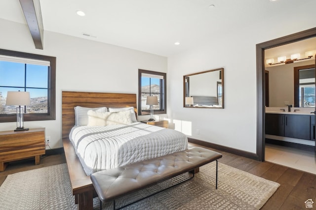10725 N Hideout Trl, Hideout, UT 84036 - bedroom with wood finished floors, multiple windows, recessed lighting, and ensuite bathroom