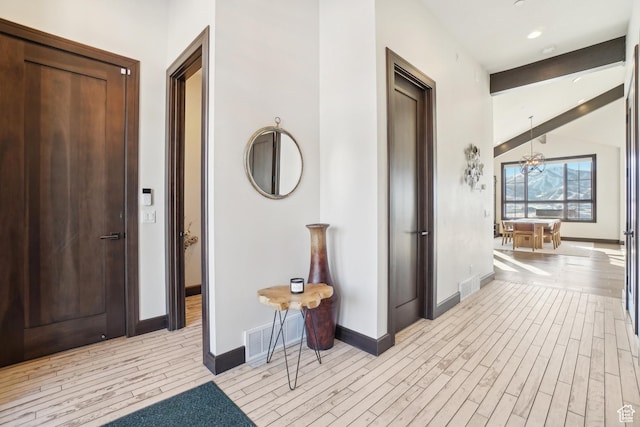 10725 N Hideout Trl, Hideout, UT 84036 - corridor with light wood-type flooring and a chandelier