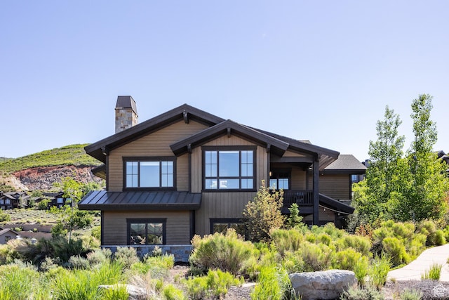 10725 N Hideout Trl, Hideout, UT 84036 - back of house with a standing seam roof, a chimney, and a metal roof