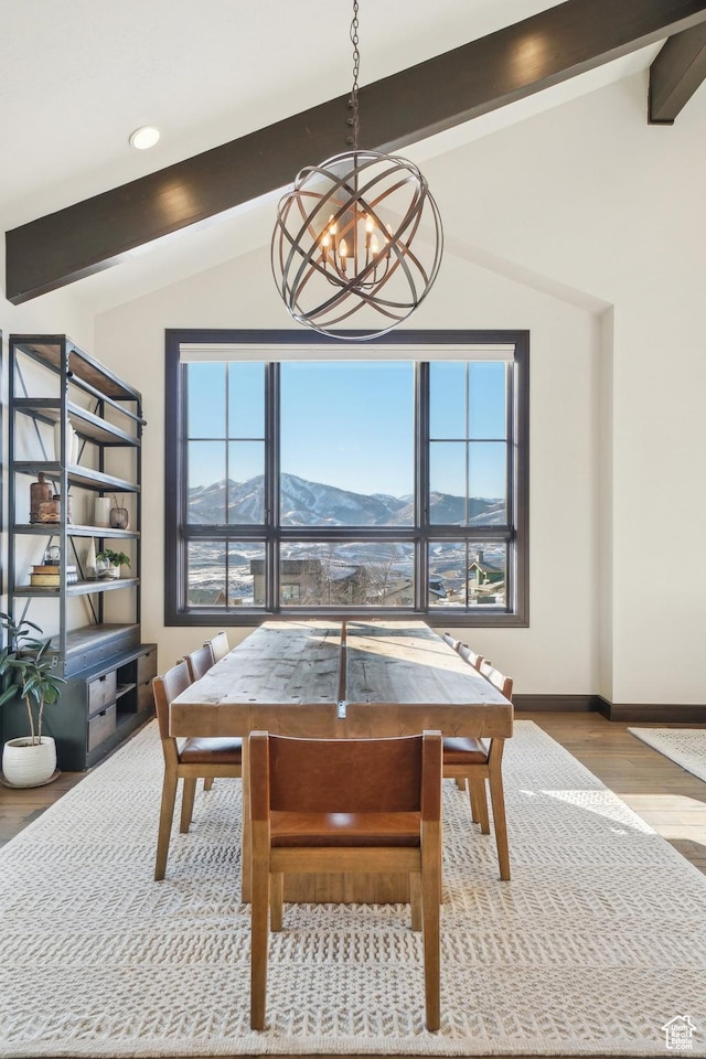 10725 N Hideout Trl, Hideout, UT 84036 - dining space featuring a chandelier, a mountain view, and wood finished floors
