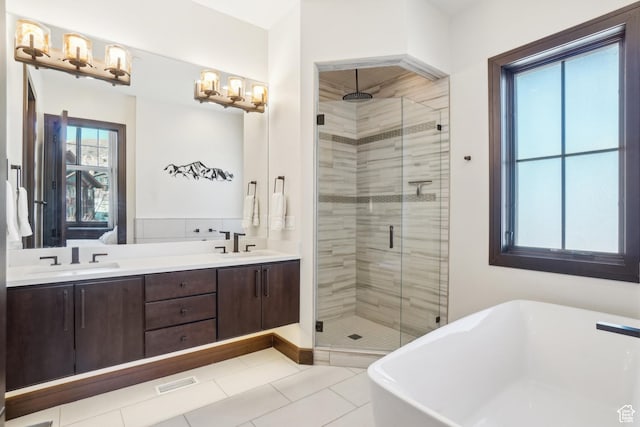 10725 N Hideout Trl, Hideout, UT 84036 - bathroom featuring a stall shower, a freestanding tub, double vanity, and tile patterned flooring