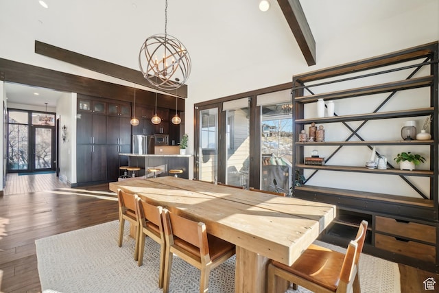 10725 N Hideout Trl, Hideout, UT 84036 - dining space featuring a chandelier, dark wood-type flooring, a high ceiling, and beam ceiling