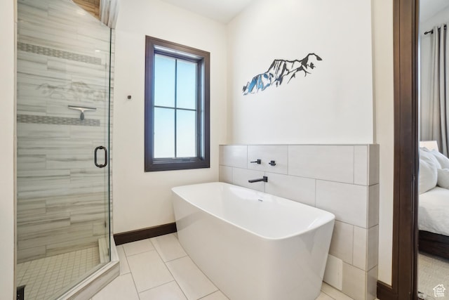 10725 N Hideout Trl, Hideout, UT 84036 - ensuite bathroom with a soaking tub, a shower stall, plenty of natural light, and tile patterned floors