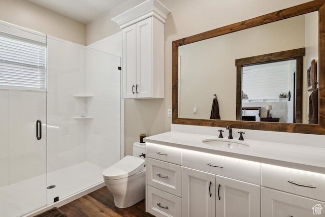 6117 Rocky Ridge Rd N, Peoa, UT 84061 - bathroom featuring vanity, hardwood / wood-style flooring, a shower with door, and toilet