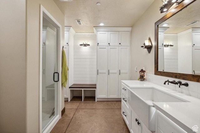 6117 Rocky Ridge Rd N, Peoa, UT 84061 - bathroom with vanity, an enclosed shower, and a textured ceiling